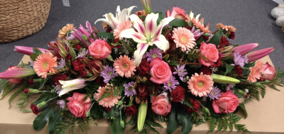 Everlasting Love Casket Spray - A luxurious casket spray featuring soft, romantic colours, lovingly designed as a meaningful expression of love and remembrance.