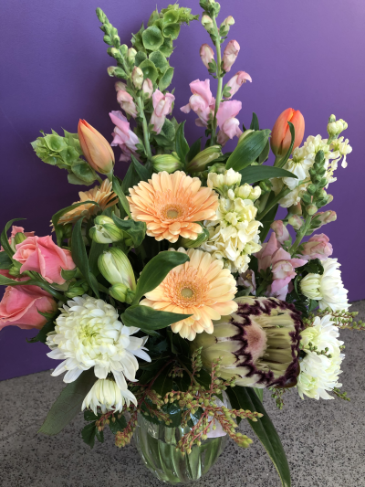Peach Meadow - A charming vase arrangement featuring soft peach and blush shades, beautifully styled to create a fresh and elegant display.