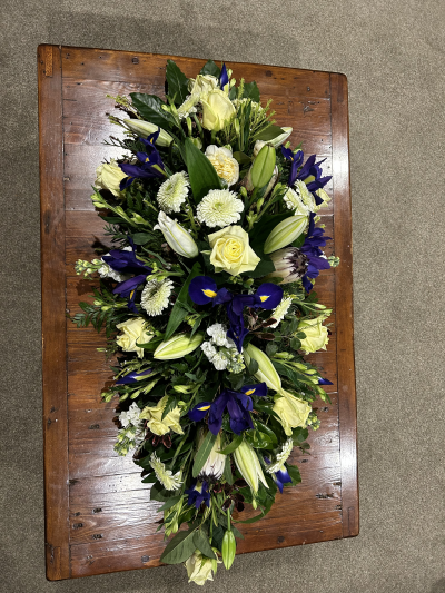 Tranquil Tribute - A graceful floral tribute thoughtfully arranged in calming shades, offering a heartfelt expression of love, remembrance and respect.